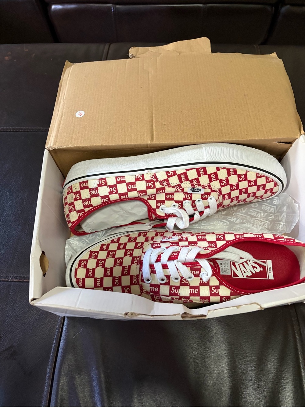 Vans Red and White Checkerboard Low-Top Sneakers with Supreme Pattern